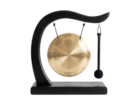 Traditional golden metal gong instrument on a black wooden stand with a mallet for sound and meditation practice isolated on transparent background