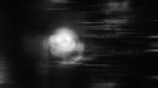 Abstract glowing light sphere with motion streaks and film grain texture abstract background creative artistic monochrome conceptual ethereal photography experiment atmosphere