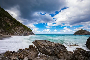 Coastal landscape of the Greek island of Euboea, with waves crashing against a rocky beach, background or travel wallpaper © anettastar