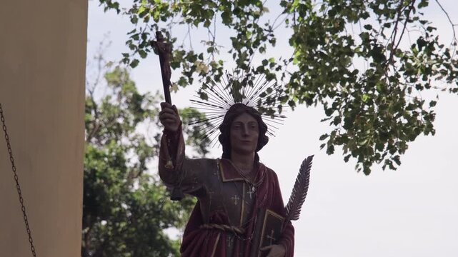 San Vito statue holding crucifix in Ricigliano procession