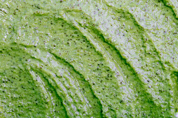 Obraz premium Green smoothie with celery, spinach, kiwi, cucumber and other vegetables and fruits. Healthy yogurt. Sorbet texture. Delicious diet food close-up as a background.