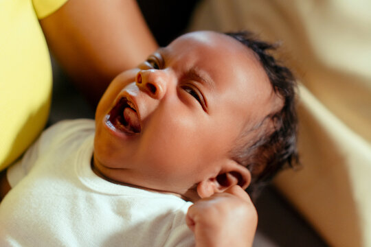 Newborn baby crying needing family care