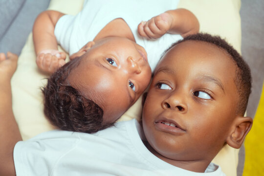 Brothers bonding together at home showing infancy
