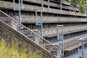 Empty Concrete Stadium Bleachers with Numbered Handrails © MarekLuthardt