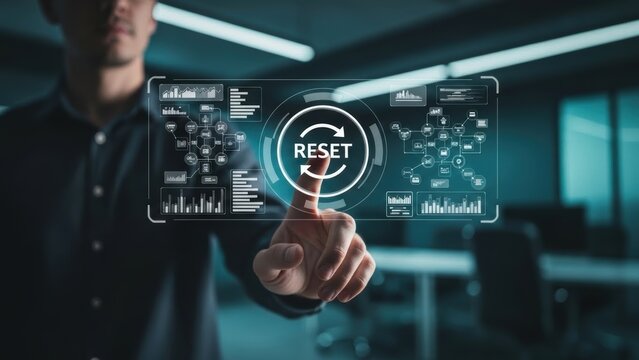Man's finger touches digital screen with reset button and data charts digital interface