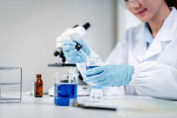 Fototapeta premium Scientist performs chemical experiment developing innovative sol
