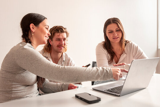 Adults collaborating in a school lesson setting