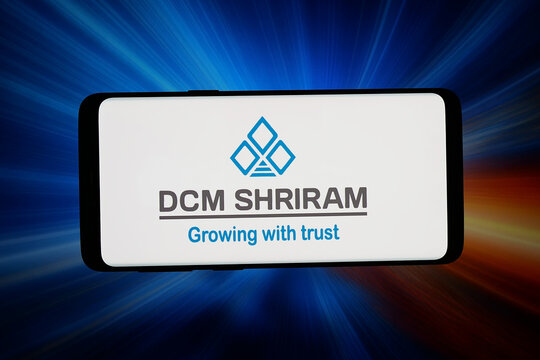 Stuttgart, Germany - 07-10-2026: In this photo illustration, the logo of Indian company DCM Shriram Ltd. is displayed on a smartphone in front of abstract background on computer screen.