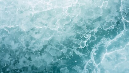 Fototapeta premium Aerial view of cracked ice on a frozen body of water surface in winter