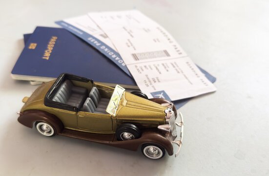 toy car resting on table or desk with travel-related mood and brown, gold accents in top-down view for vacation and adventure themes period period period period period period period period.