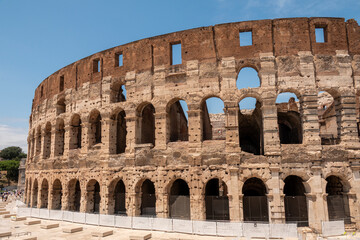Obraz premium View of Colosseum Rome, Italy on a sunny day with blue sky. The largest amphitheatre ever built.