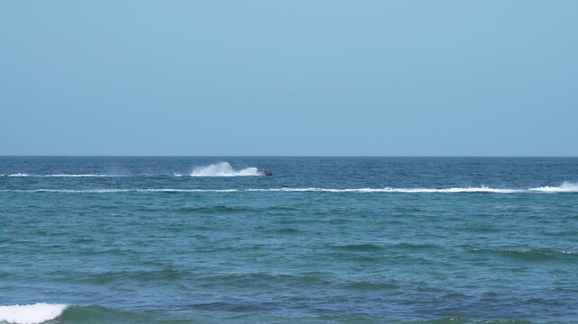 jet skies going fast in ocean