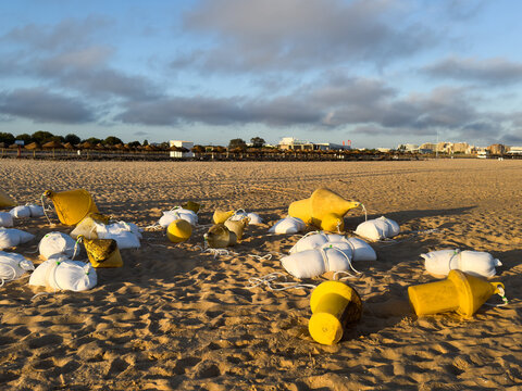 buoys with weights on the ocean shore