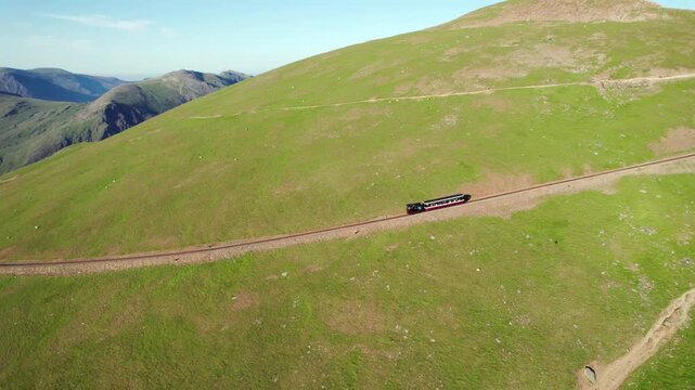 Snowdon Summit Railway, tourist mountain train in the highest peak of Wales. aerial view in summer
