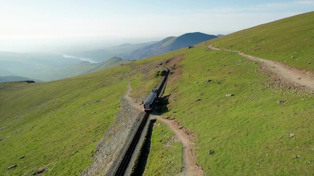 Snowdon Summit Railway, tourist mountain train in the highest peak of Wales. aerial view in summer