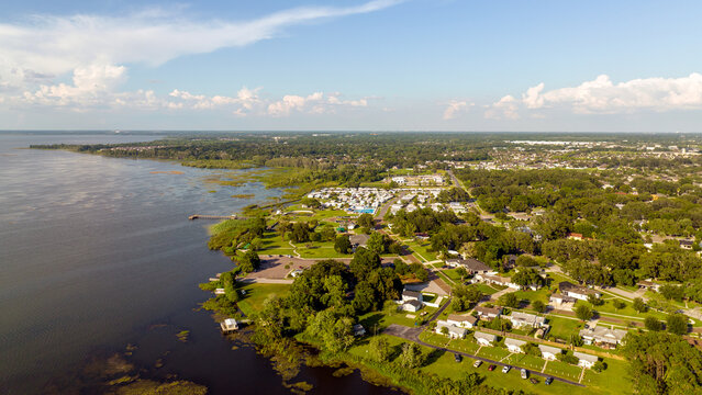 Aerial View of the Scenic Waterfront Neighborhoods and Parks Along Lake Apopka in Winter Garden, Florida. May 16, 2022.