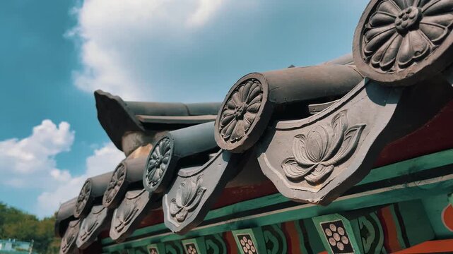 Close-up of Traditional Korean Architecture Roof Tiles with Lotus Carvings