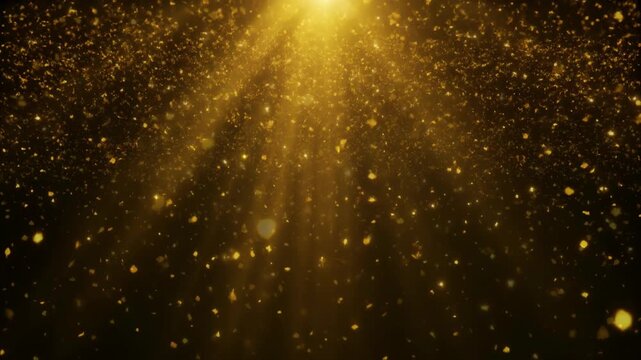 Looping festive golden confetti or shiny glitter particles falling from top with bright yellow light rays on a black background for celebration or holiday