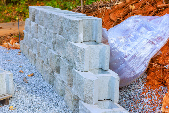 Construction site stacked concrete blocks during assemble retaining wall