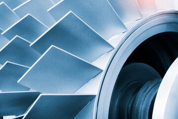 Close-up of metal turbine blades, tech industrial technology background © Aleksandr Matveev