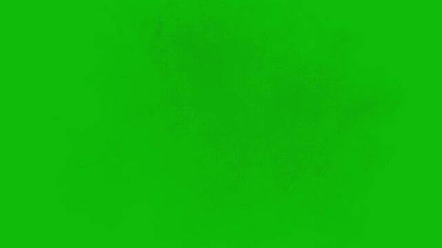 Dense white smoke or fog expanding slowly isolated on a solid green screen background for video editing mist steam explosion chroma key