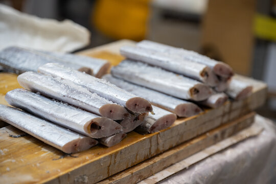 Freshly cut hairtail fish segments displayed at traditional seafood market in south korea.