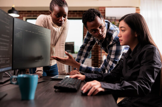 Diverse programmers discussing cloud interface code capturing looking at code on computer, working on server interface development, Programmers parsing cloud computing project with big data.