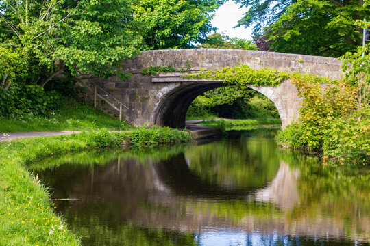 The stone bridge over The Lancaster Canal at Bolton Le Sands in Lacashire in the North West of England