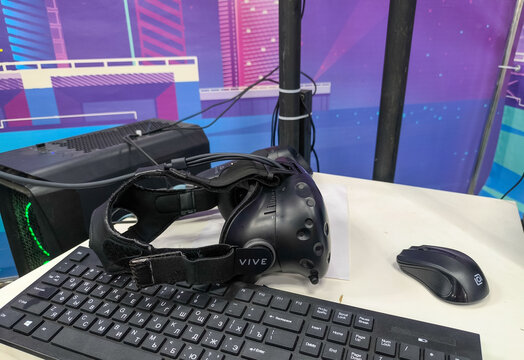 MELITOPOL, UKRAINE - JANUARY 18, 2026: VR headset and mouse on a desktop workbench with computer keyboard.