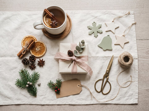 Flat lay of wrapped Christmas gift and hot chocolate