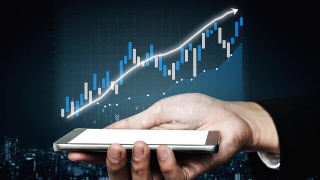 A hand holding a smartphone displays a rising financial graph with an arrow indicating growth. This image symbolizes investment success and modern market trends. Copula