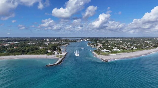 Boat headed into the Atlantic Ocean through Jupiter Inlet in Palm Beach County, Florida. 
