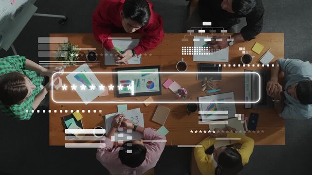 A vibrant overhead view of a diverse business team engaged in a collaborative meeting, utilizing charts and laptops to develop strategies and innovative solutions. Raster