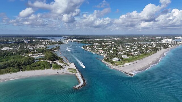 Boats headed to the Atlantic Ocean from the intracoastal at Jupiter Inlet in Palm Beach County, Florida.