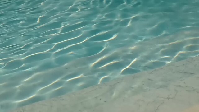 calm clear blue water surface with ripples.