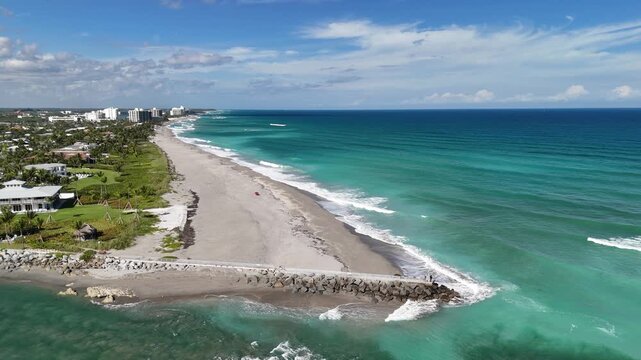 The beach and north jetty along Jupiter Inlet in the town of Jupiter in Palm Beach County, Florida. 