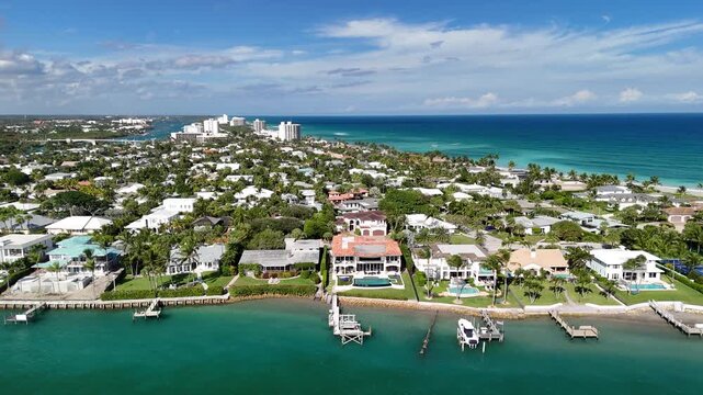 Luxury waterfront homes lining Jupiter Inlet in the town of Jupiter in Palm Beach County, Florida. 