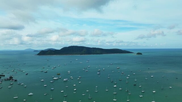 Aerial view Drone hyperlapse of Yacht and sailboat in the pier, Chalong bay Phuket thailand,Amazing sunny sky clouds over sea,Timelapse sky sunny day time, Blue sky clouds background