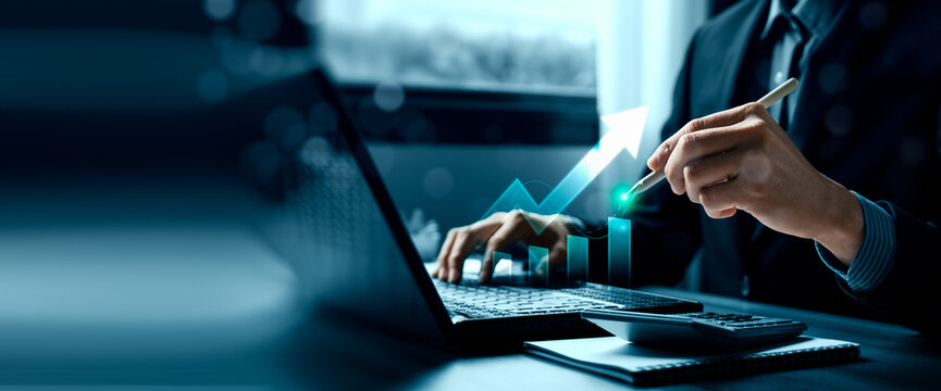Business financial growth concept with professional using laptop and stylus showing rising arrow chart digital analytics performance improvement and revenue strategy planning