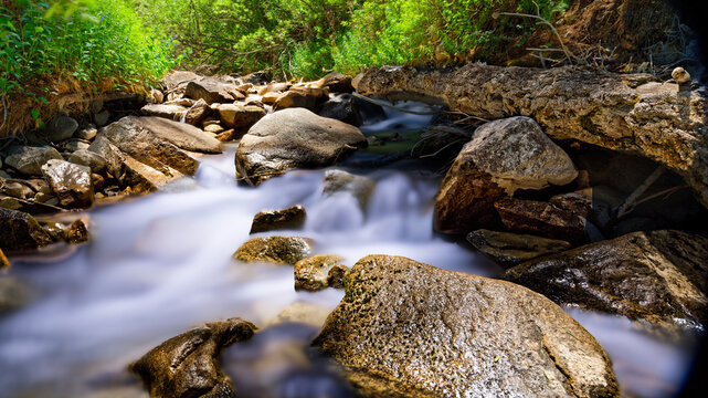 Stream Flowing Over River Rocks