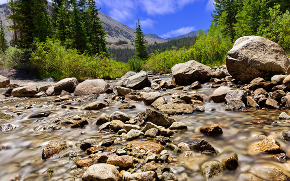 Stream Flowing Over River Rocks