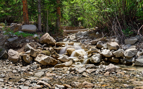 Stream Flowing Over River Rocks