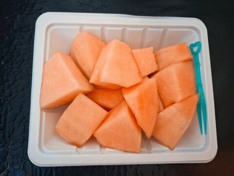 Sweet orange melon chunks as a healthy fresh fruit snack to go