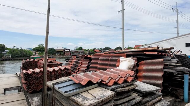 Stacked Roof Tiles on a Riverbank Construction Site in Thailand