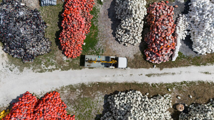 Aerial view of an open storage yard with white red and black fishing buoys. Equipment used for aquaculture and commercial fishing. © soya