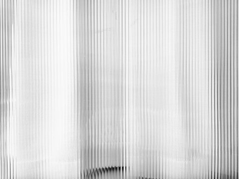 Modern Vertical Fluted Glass Wall Texture with Dramatic Light and Shadow Overlay.