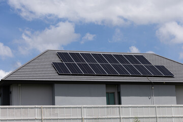 Fototapeta premium Modern home with solar panels on roof