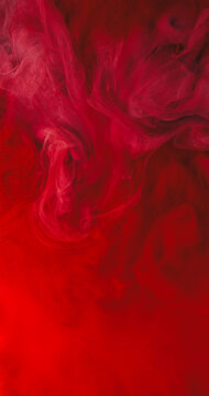 Magic ink splash. Pigment blend. Red fume paint swirl in liquid. Defocused curl stream bright dye drop explosion abstract background.