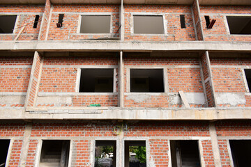 Obraz premium exterior view of brick house under construction with concrete structure