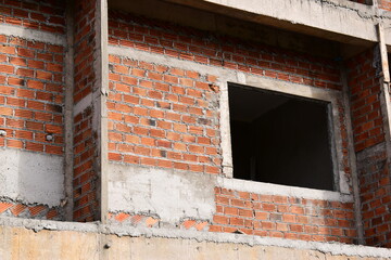 Obraz premium exterior view of brick house under construction with concrete structure